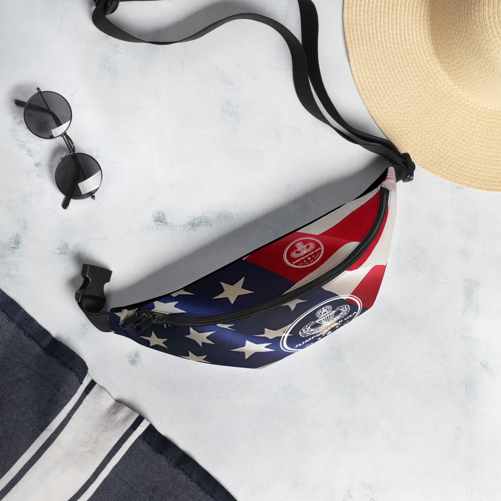 This Fanny pack is the ultimate accessory for stylish Jumpmasters on the go. This waist bag has everything—the right size, a small inside pocket, and adjustable straps—to become your favorite fashion item if you're going to a festival, getting ready for a vacation, or just like to keep your hands free.