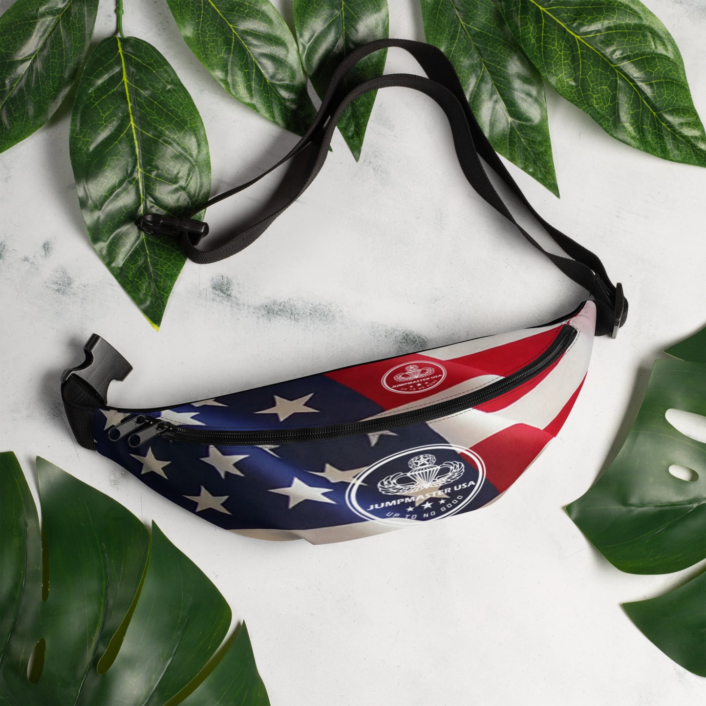This Fanny pack is the ultimate accessory for stylish Jumpmasters on the go. This waist bag has everything—the right size, a small inside pocket, and adjustable straps—to become your favorite fashion item if you're going to a festival, getting ready for a vacation, or just like to keep your hands free.